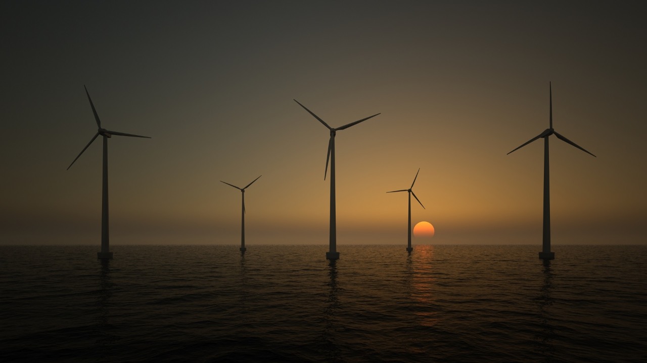 wind turbines on the rising sun background