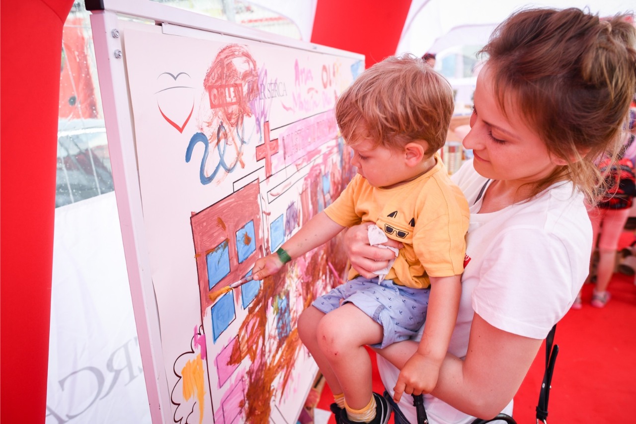 A child drawing on a drawing board