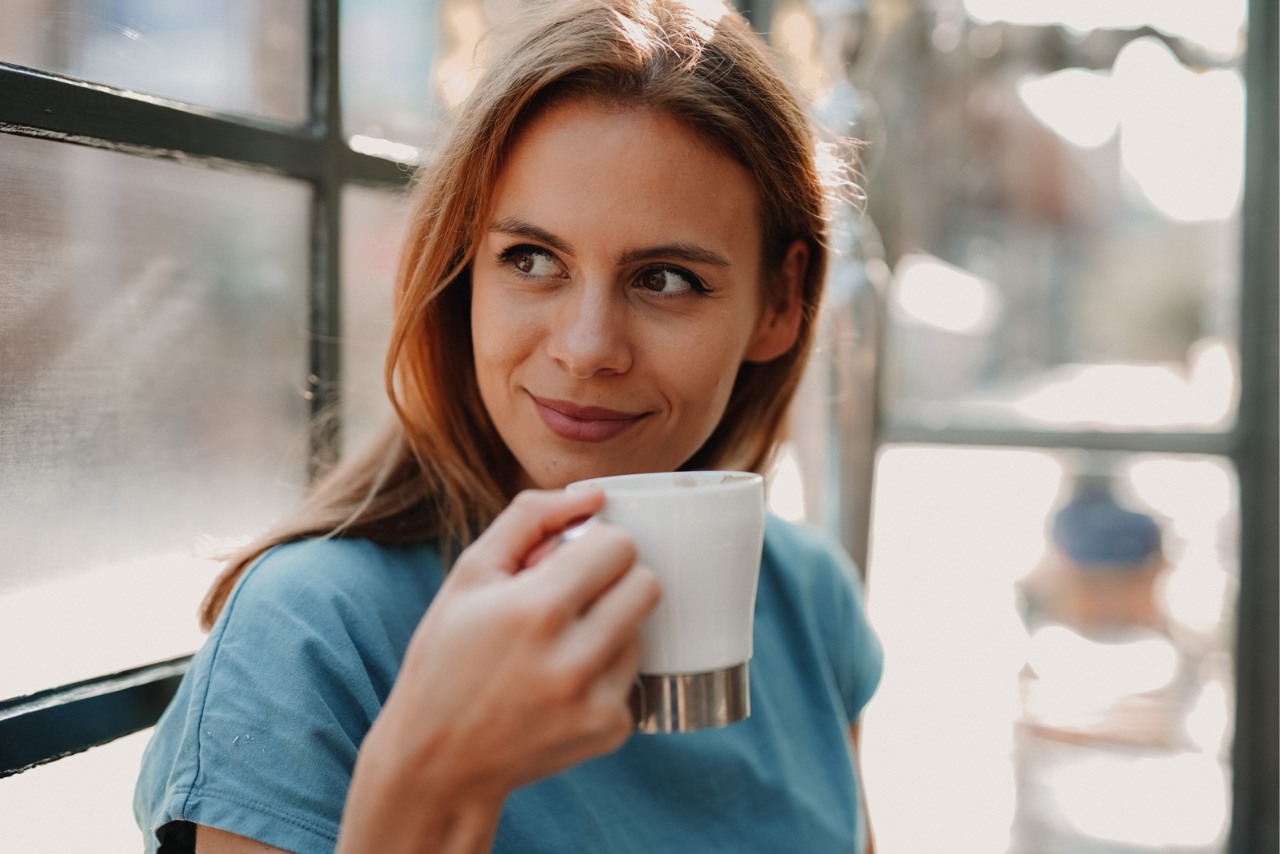 A woman with a cup of coffee