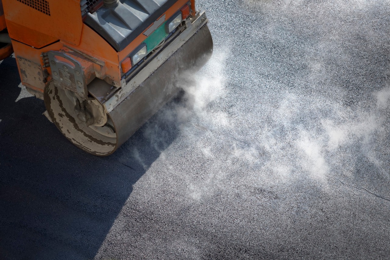 Heavy Vibration roller compactor at asphalt pavement works for road repairing