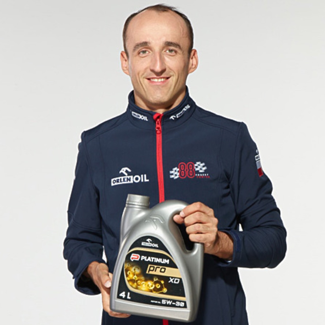 Robert Kubica holds Oil