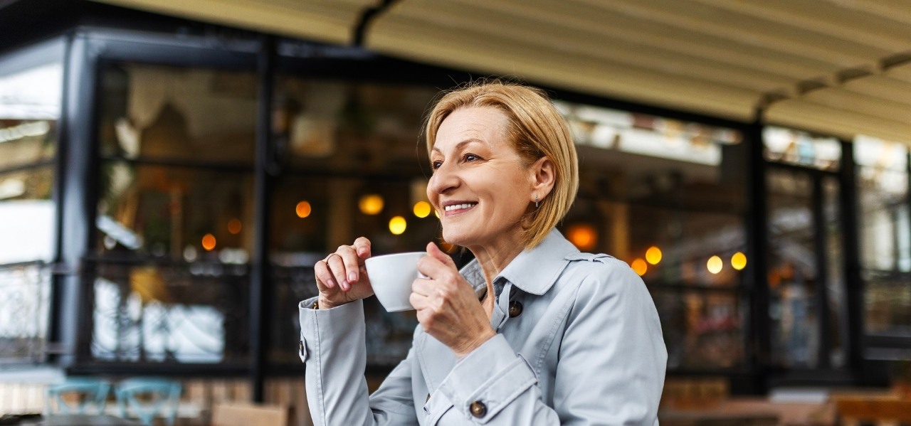 Happy Business Woman Drinking Coffee In The Restaurant